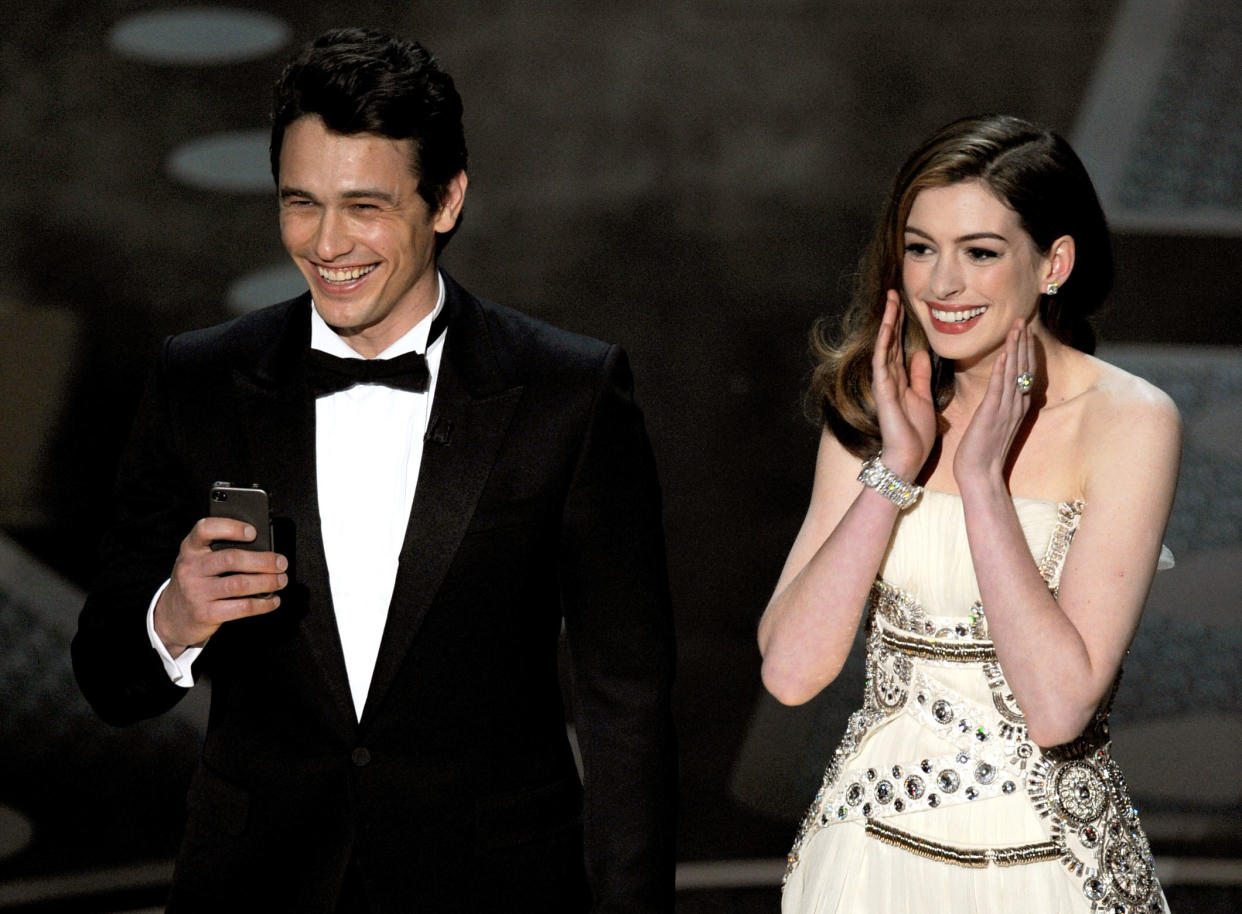 James Franco and Anne Hathaway speak onstage during the 83rd Annual Academy Awards held at the Kodak Theatre on February 27, 2011 in Hollywood, California.  (Photo by Kevin Winter/Getty Images)