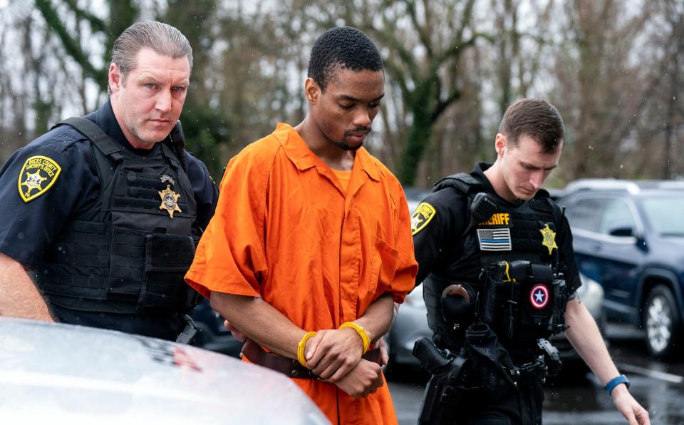 Andre Gordon Jr., center, walks into district court in Falls Township on Wednesday, April 3, 2024. He is charged with three murders, carjacking and other charges in a March 16, 2024 crime spree in Lower Bucks County and Trenton.