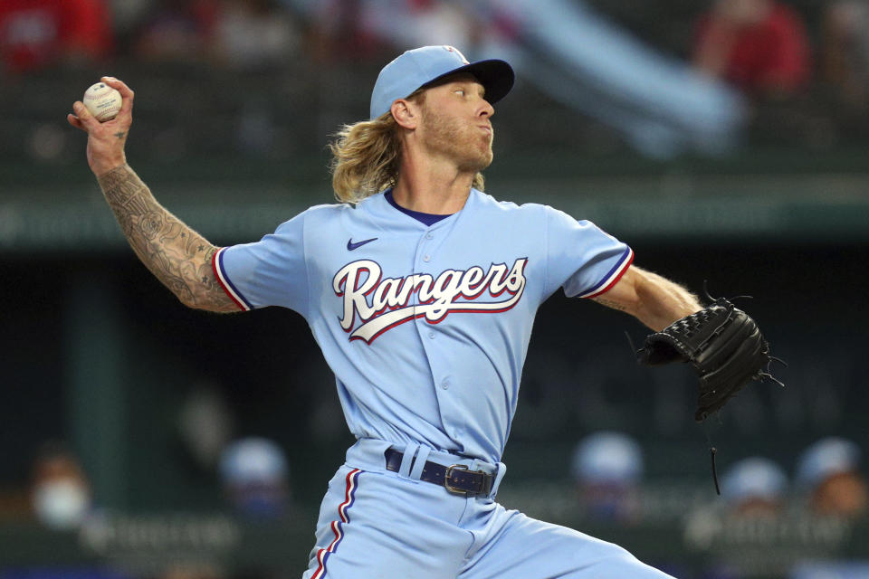 Texas Rangers starting pitcher Mike Foltynewicz delivers a pitch against the San Diego Padres in the first inning during a baseball game on Sunday, April 11, 2021, in Arlington, Texas. (AP Photo/Richard W. Rodriguez)