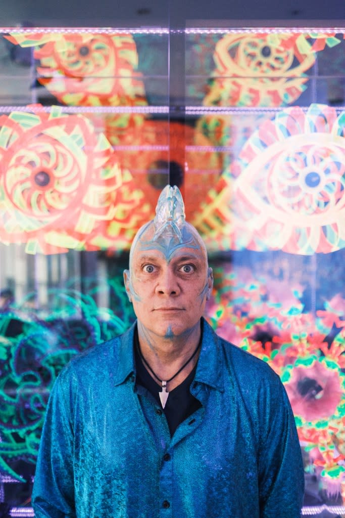 Chris Wink wears a headpiece in his psychedelic apartment. Stephen Yang