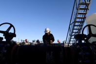 Carlos Riojas prepares to check a filter at a wastewater injection facility operated by On Point Energy in Big Spring, Texas U.S. February 12, 2019. Picture taken February 12, 2019. REUTERS/Nick Oxford