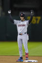 Cleveland Guardians' Brayan Rocchio celebrates after hitting a two-run double against the Oakland Athletics during the fourth inning of a baseball game Thursday, March 28, 2024, in Oakland, Calif. (AP Photo/Godofredo A. Vásquez)