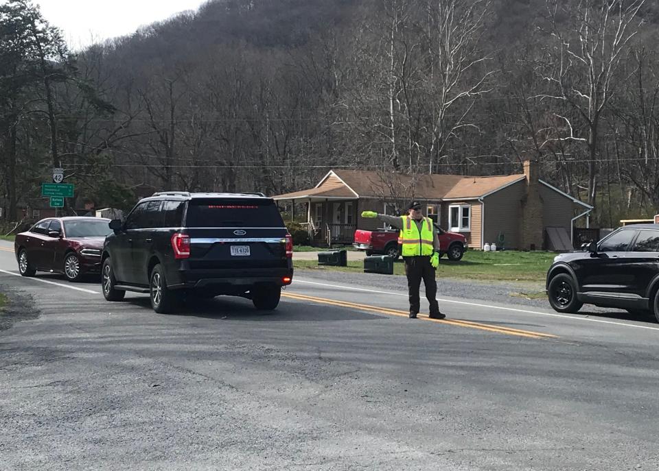 Maj. Brian Jenkins of the Augusta County Sheriff's Office directs traffic Wed., March 20, 2024, at the intersection of Parkersburg Turnpike and Hewitt Road following a fatal crash.