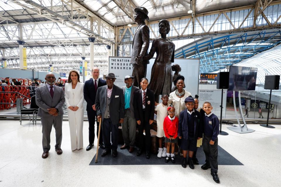 The Duke and Duchess of Cambridge, accompanied by Baroness Floella Benjamin, Windrush passengers Alford Gardner and John Richards and children at the unveiling of the National Windrush Monument at Waterloo Station, (PA)