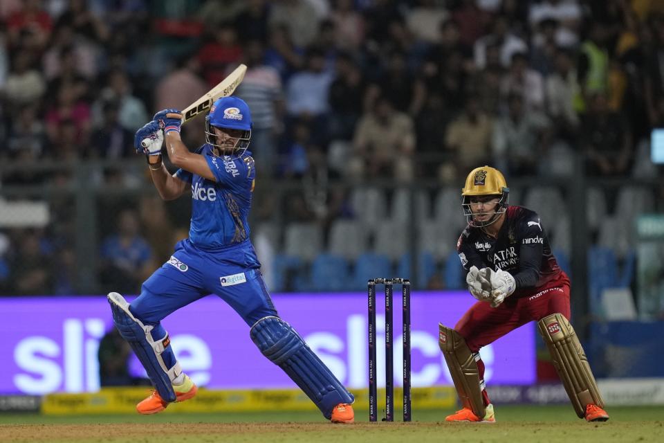 Mumbai Indians' Nehal Wadhera bats during the Indian Premier League cricket match between Mumbai Indians and Royal Challengers Bangalore in Mumbai, India, Tuesday, May 9, 2023. (AP Photo/Rajanish Kakade)