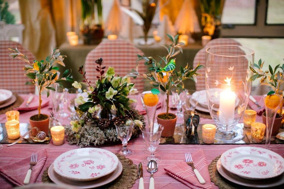 <p>"For Thanksgiving centerpieces, I usually keep things quite organic with low-lying warm colors and in-season foraging if you're in a place where the leaves are still turning," says photographer, tastemaker, and shop owner <a href="https://go.redirectingat.com?id=74968X1596630&url=https%3A%2F%2Flucycuneo.com%2F&sref=https%3A%2F%2Fwww.veranda.com%2Fluxury-lifestyle%2Fentertaining%2Fg33567880%2Fthanksgiving-centerpieces%2F" rel="nofollow noopener" target="_blank" data-ylk="slk:Lucy Cuneo;elm:context_link;itc:0;sec:content-canvas" class="link ">Lucy Cuneo</a>. "It's always striking to use a mix of green, gold, and red leaves on a table." </p><p>Here, Cuneo pairs seasonal flora with warm, autumnal shades of red to create a Thanksgiving centerpiece that invites everyone to gather. She loves to mix an assortment of candle votives down the table to add ambiance without blocking views of family and friends. </p>