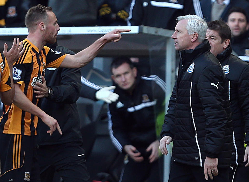 Newcastle United's manager Alan Pardew, right, and Hull City's David Meyler, left, confront each other during the during the English Premier League match at the KC Stadium, Hull England Saturday March 1, 2014. (AP Photo/Lynne Cameron/PA) UNITED KINGDOM OUT