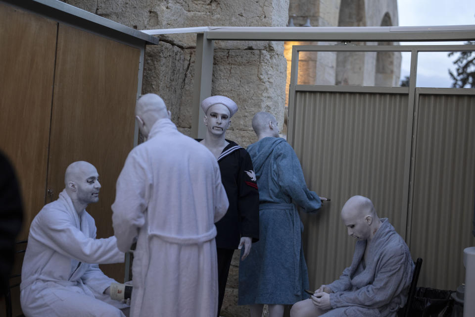 Performers prepare to go on stage at the Odeon of Herodes Atticus for a performance of "Madame Butterfly" in Athens, on Friday, June 1, 2023. The annual arts festival in Athens and at the ancient theater of Epidaurus in southern Greece is dedicated this year to the late opera great Maria Callas who was born 100 years ago. (AP Photo/Petros Giannakouris)