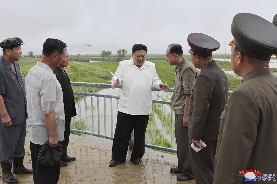 In this undated photo provided on Monday, Aug. 14, 2023, by the North Korean government, North Korean leader Kim Jong Un, center, visits storm Khanun-hit area at Anbyon County of Kangwon Province, North Korea. Independent journalists were not given access to cover the event depicted in this image distributed by the North Korean government. The content of this image is as provided and cannot be independently verified. Korean language watermark on image as provided by source reads: "KCNA" which is the abbreviation for Korean Central News Agency. (Korean Central News Agency/Korea News Service via AP)