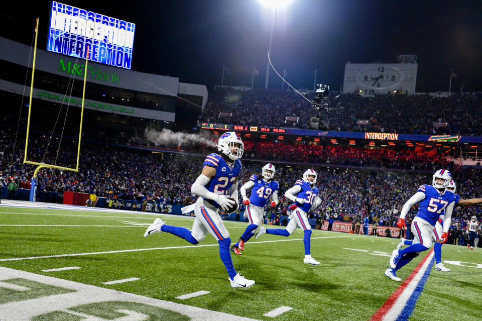 Buffalo Bills safety Micah Hyde, center, celebrates after catching an interception during the first half of an NFL wild-card playoff football game against the New England Patriots, Saturday, Jan. 15, 2022, in Orchard Park, N.Y. (AP Photo/Adrian Kraus)