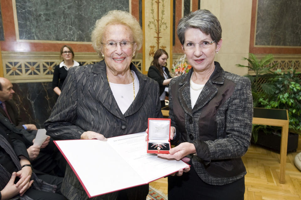 In this Aug. 31, 2012 photo provided by the Austrian parliament 95 year-old soprano Hilde Zadek, left, receives the Great Medal of Honor of the Austrian Republic bey the speaker of the parliament Barbara Prammer, right, at the parliament in Vienna, Austria. For Zadek, the city she once despised as part of Hitler's evil empire has long become a home that she says she would never leave _ and one that is proud to call her own. She has been showered with medals, granted high honorary titles and a singer's competition named after her 13 years ago has turned into an international launching pad for future opera stars. (AP Photo/Parlamentsdirektion/Bildagentur Zolles KG/Jacqueline Godany)