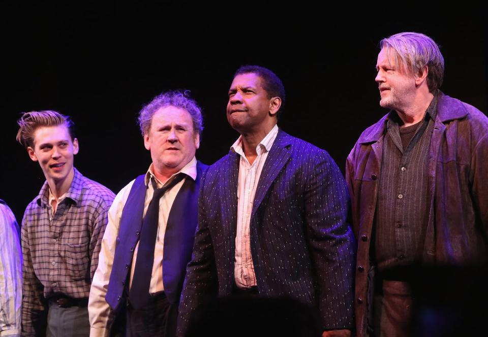 austin butler, colm meaney, denzel washington, and david more standing together on a stage looking outward