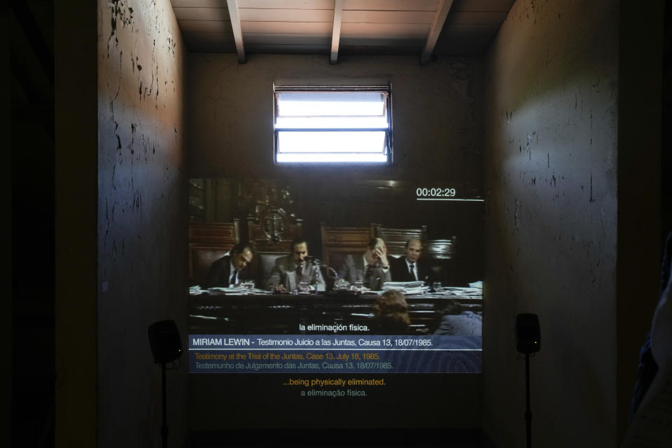 A video streams the "Trial of the Juntas," inside a cell of the former Navy School of Mechanics, known as ESMA, now a human rights museum, in Buenos Aires, Argentina, Friday, March 22, 2024. Until democracy was regained in 1983, at least 30,000 people disappeared during the country's military dictatorship. (AP Photo/Natacha Pisarenko)