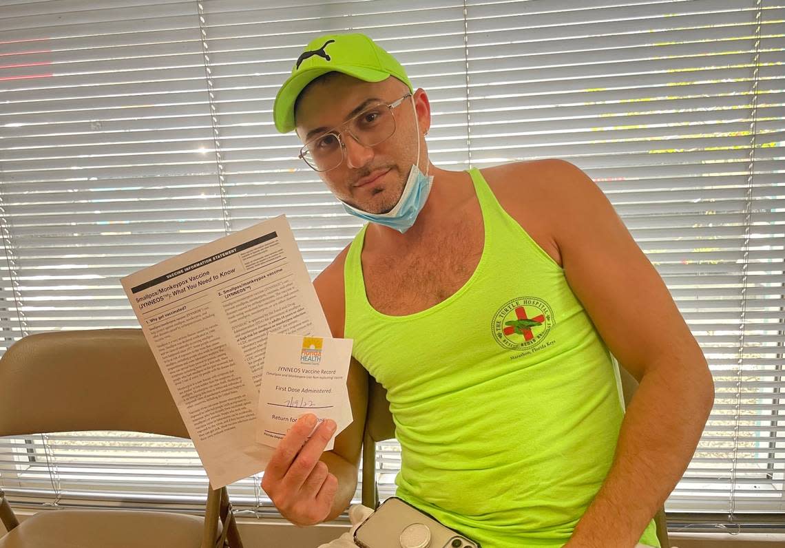 Matt Gantenbein, 33, poses with his vaccine card after receiving the monkeypox shot at the Pride Center at Equality Park in Wilton Manors, Florida, on Tuesday, July 19, 2022.