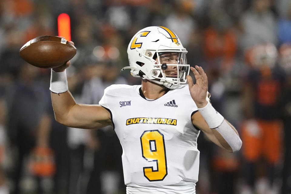 Chattanooga quarterback Preston Hutchinson looks for a receiver during the first half of the team's NCAA college football game against Illinois on Thursday, Sept. 22, 2022, in Champaign, Ill. (AP Photo/Charles Rex Arbogast)