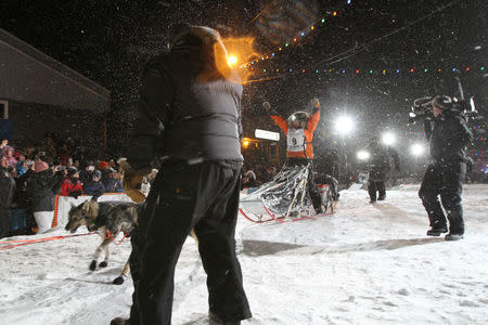 Pete Kaiser of of Bethel, Alaska crosses the finish line to win the Iditarod Trail Sled Dog Race in Nome, Alaska, U.S. March 13, 2019. REUTERS/Diana Haecker/Nome Nugget