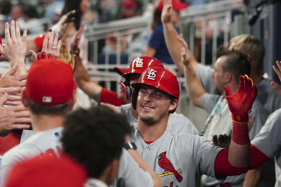 St. Louis Cardinals' Nolan Gorman (16) celebrates in the dugout after hitting a three-run home run in the eighth inning of a baseball game against the Atlanta Braves Wednesday, Sept. 6, 2023, in Atlanta. (AP Photo/John Bazemore)