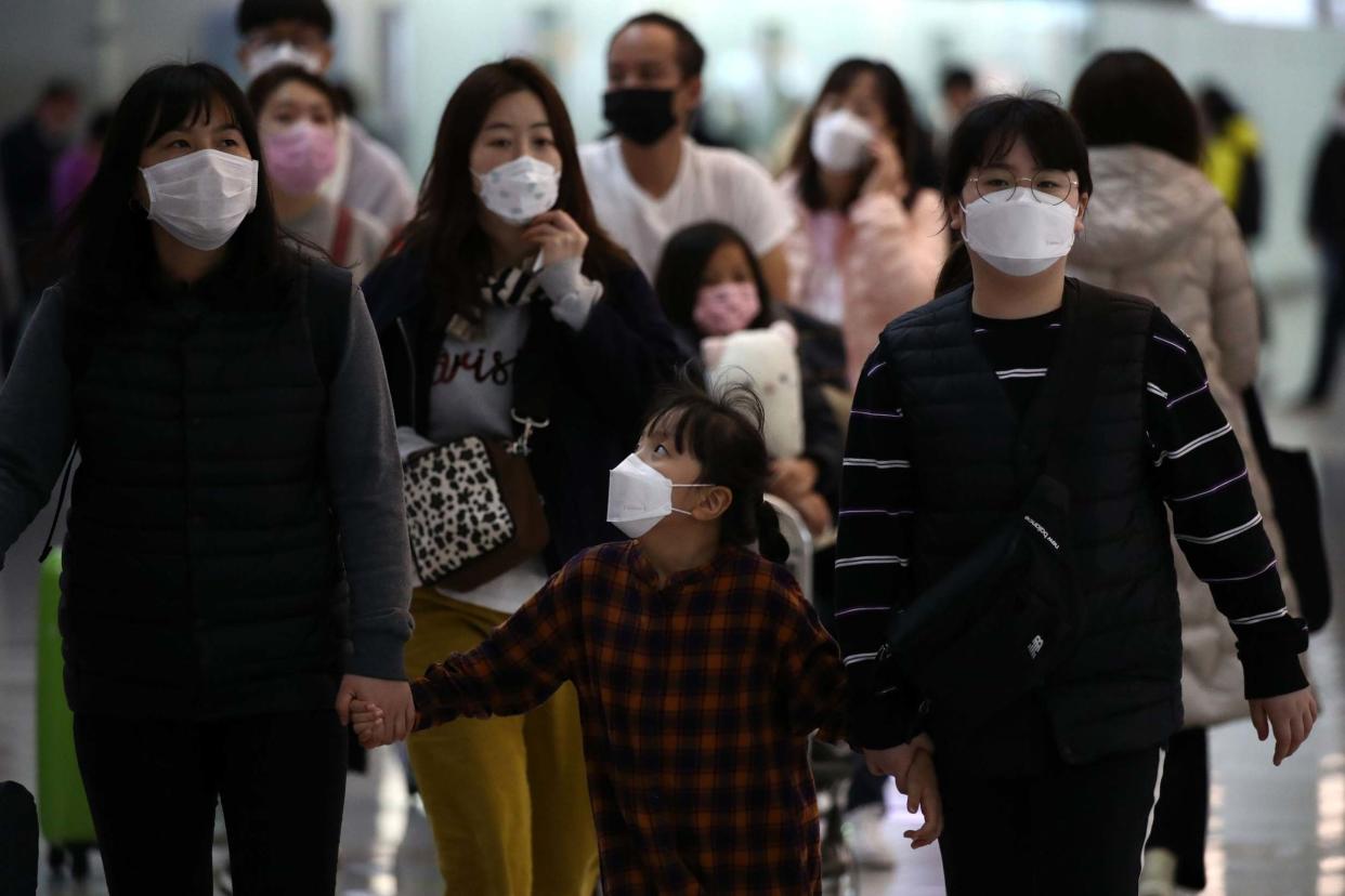 People wearing masks at the Incheon International Airport: Getty Images