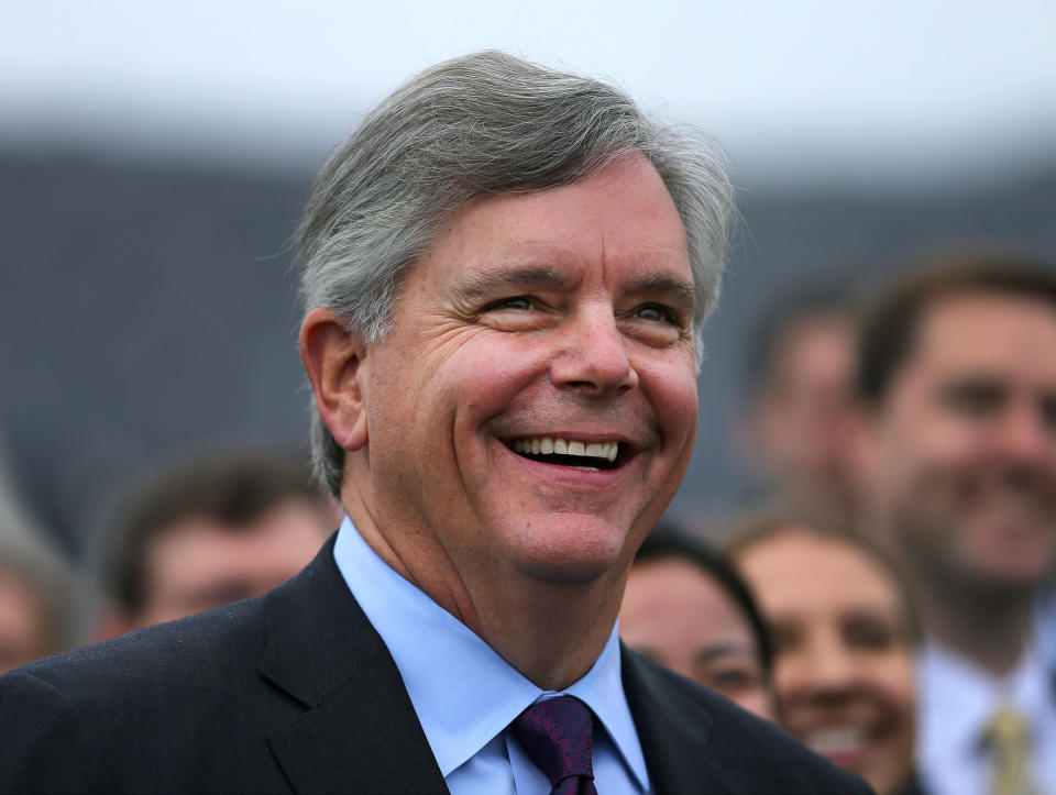 General Electric CEO Larry Culp smiles before a crowd