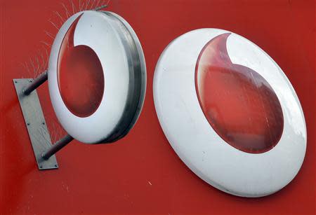 Vodafone branding is seen outside a retail store in London November 12, 2013. REUTERS/Toby Melville