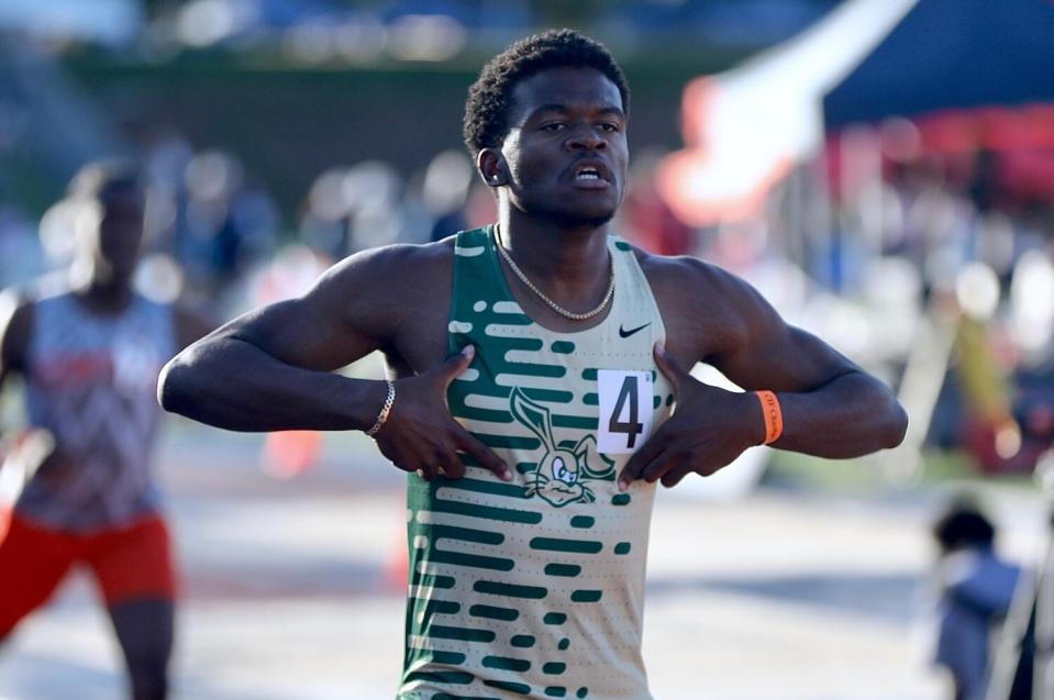 Long Beach Poly's Xai Ricks celebrates after winning the boys 400-meter state title.