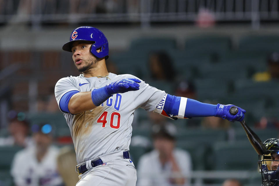 ATLANTA, GA - APRIL 27: Willson Contreras #40 of the Chicago Cubs hits a double to bring in a run during the tenth inning of an MLB game against the Atlanta Braves at Truist Park on April 27, 2022 in Atlanta, Georgia. (Photo by Todd Kirkland/Getty Images)