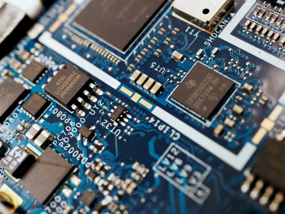  Semiconductor chips on a circuit board of a computer.