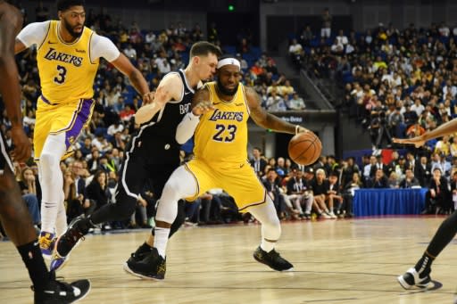 Sports stars like LeBron James -- pictured at a pre-season match in Shanghai, China -- will be part of the attraction for platforms about to be launched by WarnerMedia and Disney