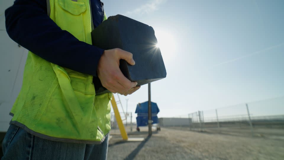 Ponec holds a carbon block like what's used in Antora's thermal battery. - Julian Quinones/CNN