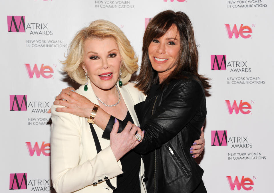 FILE - In this April 22, 2013 file photo, Television personalities Joan Rivers, left, and daughter Melissa Rivers attend the 2013 Matrix New York Women in Communications Awards at the Waldorf-Astoria Hotel, in New York. Attorneys for two women held in a Cleveland home and abused for a decade say Joan Rivers should apologize for comparing living in her daughter's guest room with the captivity they experienced. Rivers and her daughter were discussing their reality show Tuesday, April 22, 2014, on NBC's "Today" show when she complained about her living arrangements, saying, "Those women in the basement in Cleveland had more space." (Photo by Evan Agostini/Invision/AP, file)