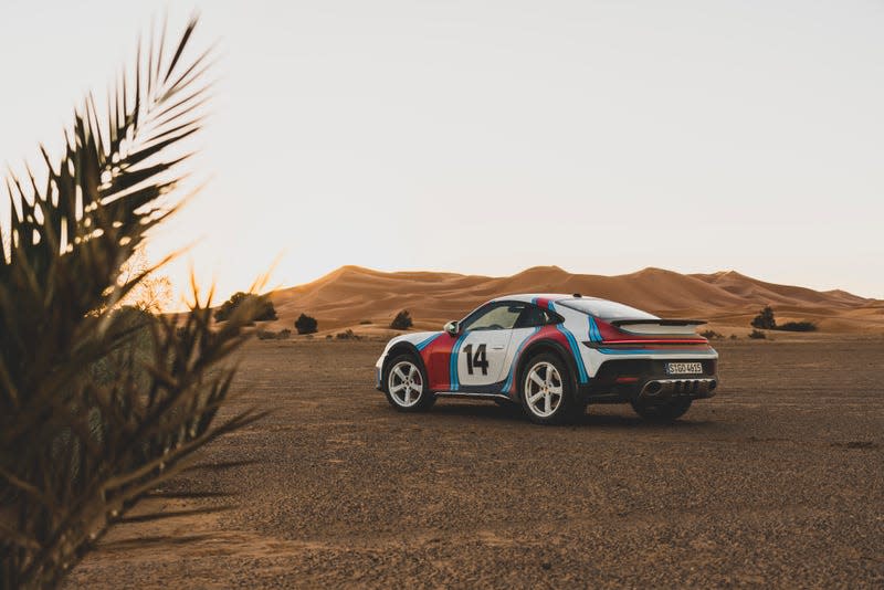Porsche 911 Dakar parked in the desert with Rallye 1978 livery