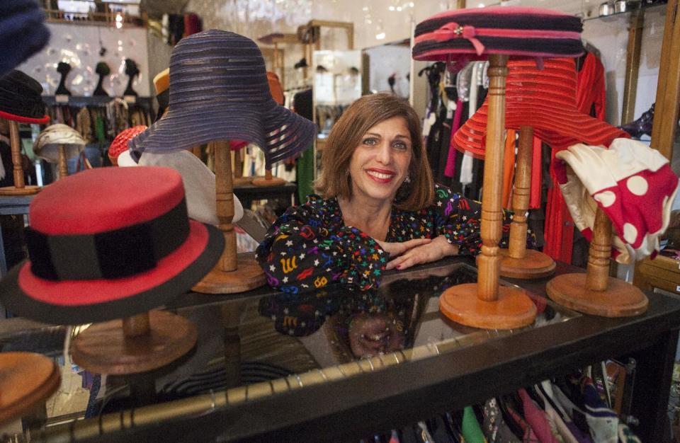 In this photo taken Thursday, Feb. 21, 2013, owner Doris Raymond poses for a photo at her Hollywood high-end vintage store, "The Way We Wore," in the La Brea District of Los Angeles. Raymond's vintage clothing and accessories store is featured in the reality TV series, "L.A. Frock Stars," which debuts March 7, 2013 on the Smithsonian Channel. (AP Photo/Damian Dovarganes)