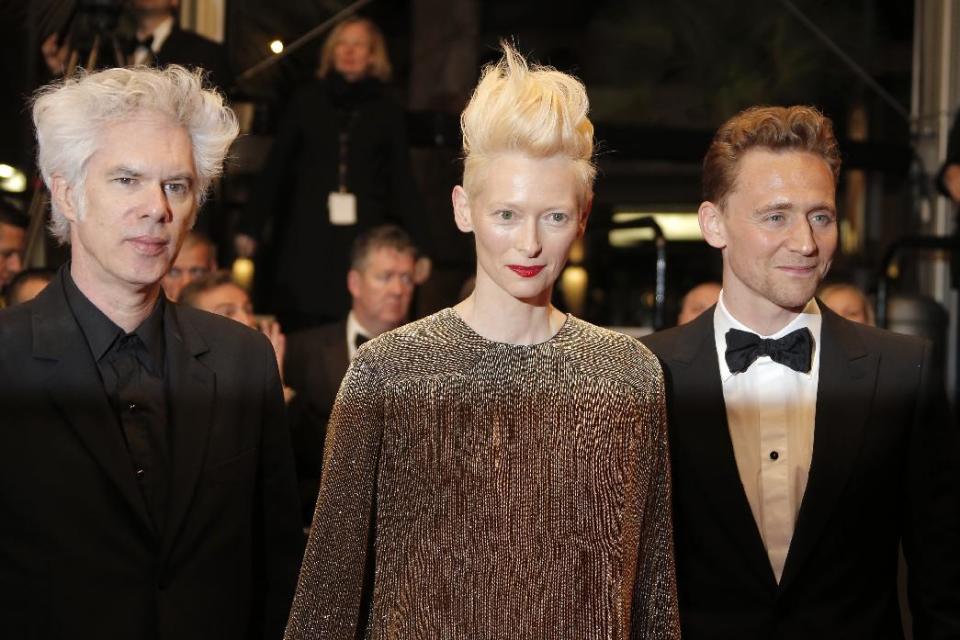 From left, director Jim Jarmusch, actors Tilda Swinton and Tom Hiddleston arrive for the screening of Only Lovers Left Alive at the 66th international film festival, in Cannes, southern France, Saturday, May 25, 2013. (AP Photo/Francois Mori)