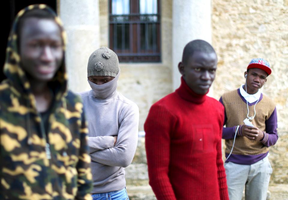 Adolescent migrants stand at a courtyard at an immigration centre in Caltagirone, Sicily March 18, 2015. The number of migrants reaching Italy by sea this year is set to top last year's record of 170,000, the International Organization for Migration (IOM) said. In the past week alone 10,000 have arrived. Another 400 people drowned before making it to Italy's shores, survivors said. The number of minors traveling alone in this mass migration has soared -- underage arrivals to Italy tripled in 2014 from the previous year. Picture taken March 18, 2015. To match Insight ITALY-MIGRANTS/BOYS REUTERS/Alessandro Bianchi TPX IMAGES OF THE DAY