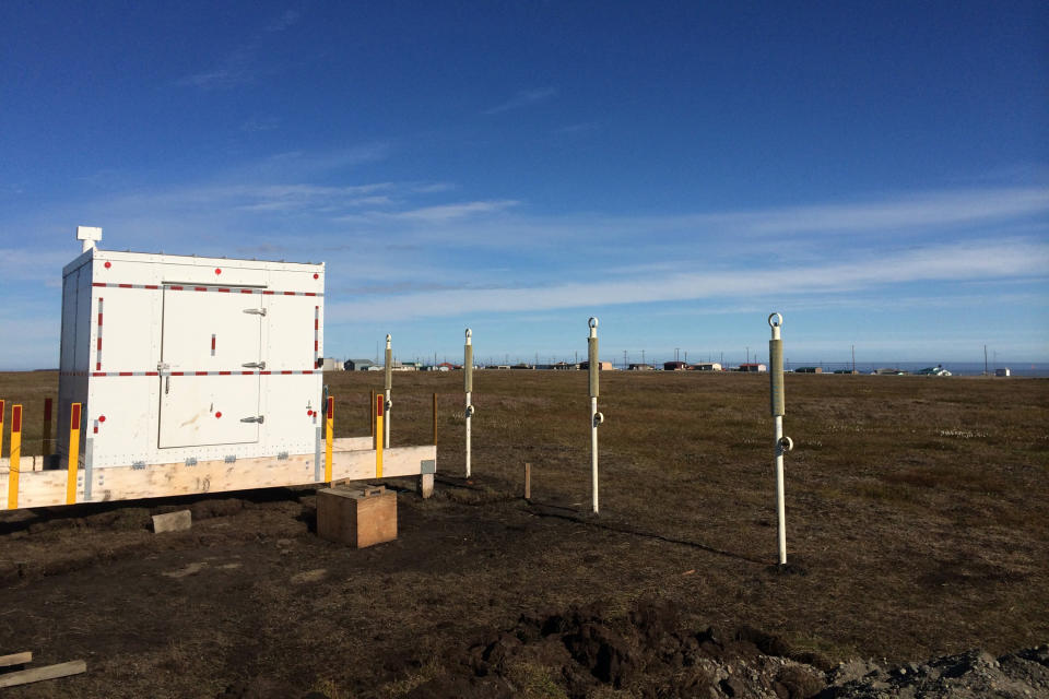 This undated photo in Kaktovik, Alaska, shows a shelter covering the entrance to a new community ice cellar, a type of underground food cache dug into the permafrost to provide natural refrigeration used for generations in far-north communities. Naturally cooled underground ice cellars, used in Alaska Native communities for generations, are becoming increasingly unreliable as a warming climate and other factors touch multiple facets of life in the far north. (Marnie Isaacs/Kaktovik Community Foundation via AP)