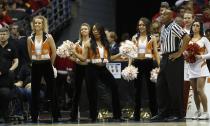 Texas cheerleaders perform during the first half of a third-round game between the Michigan and the Texas of the NCAA college basketball tournament Saturday, March 22, 2014, in Milwaukee. (AP Photo/Jeffrey Phelps)