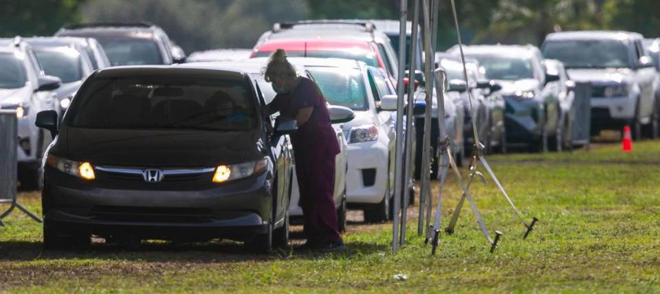 Cars line up at Amelia Earhart Parks COVID-19 testing site in Hialeah, Florida on Friday, July 30, 2021.