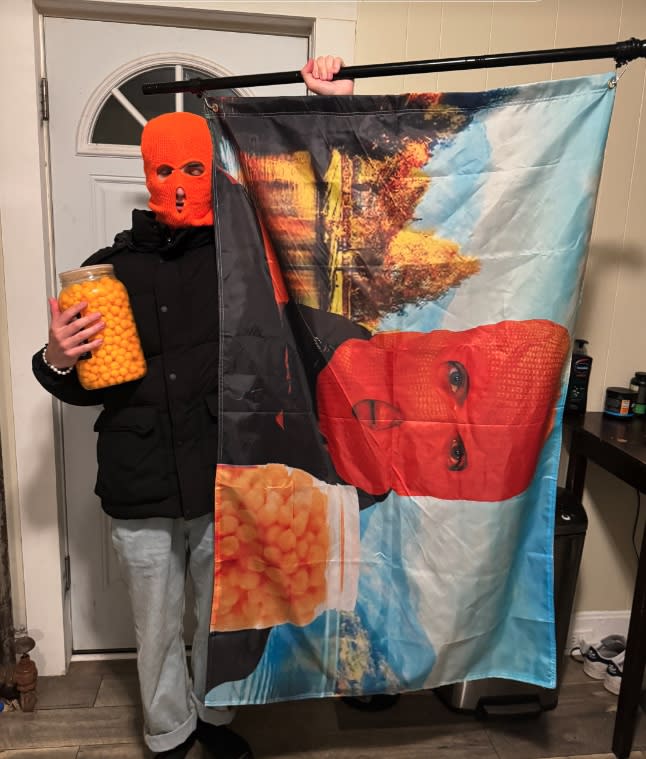 Cheeseball Man ran around with a flag of himself. TikTok / cheeseballman427