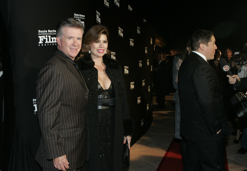 FILE - In this Nov. 19, 2010, file photo, Alan and Tanya Thicke pose on the red carpet before Santa Barbara International Film Festival. Tanya Thicke says her husband was laid to rest Monday, Dec. 19, 2016, six days after the actor suffered a fatal heart attack. (AP Photo/Spencer Weiner, File)