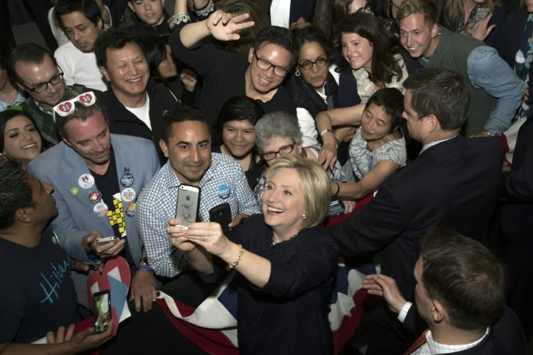 Democratic presidential candidate Hillary Clinton takes a selfie with fans after speaking at a rally in San Francisco, California on May 26, 2016