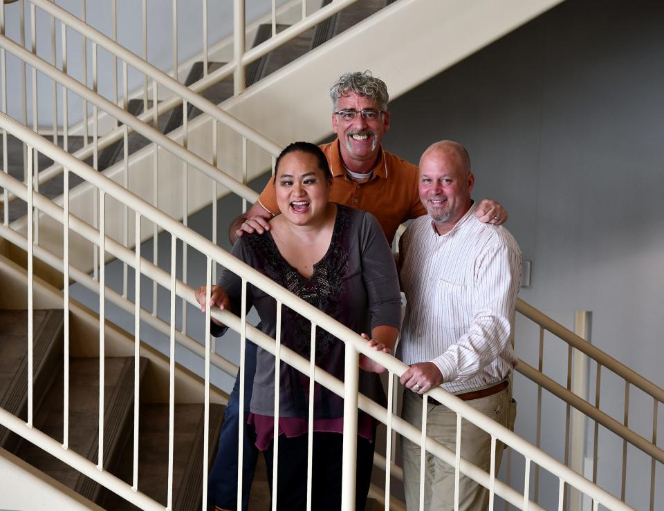 Lavender Darcangelo (who is competing on "America's Got Talent") with her adopted fathers Jamie and Wil, right.