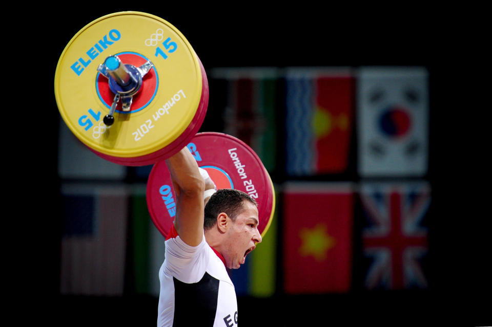 LONDON, ENGLAND - AUGUST 01: Ibrahim Ramadan Ibrahim of Egypt competes in the Men's 77kg Weightlifting on Day 5 of the London 2012 Olympic Games at ExCeL on August 1, 2012 in London, England. (Photo by Laurence Griffiths/Getty Images)