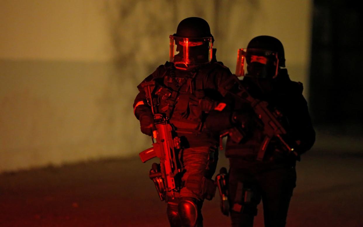 French special police forces secure an area during a police operation in the Meinau district after the deadly shooting in Strasbourg - REUTERS