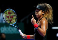 Tennis - WTA Tour Finals - Singapore Indoor Stadium, Kallang, Singapore - October 22, 2018 Japan's Naomi Osaka reacts during her group stage match against Sloane Stephens of the U.S. REUTERS/Edgar Su