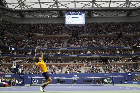 Sep 9, 2018; New York, NY, USA; Juan Mart’n Del Potro of Argentina serves against Novak Djokovic of Serbia (R) in the men's final on day fourteen of the 2018 U.S. Open tennis tournament at USTA Billie Jean King National Tennis Center. Mandatory Credit: Geoff Burke-USA TODAY Sports