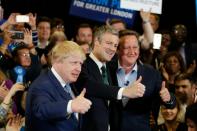 Conservative Party London mayoral candidate Zac Goldsmith (C), London Mayor Boris Johnson (L) and Prime Minister David Cameron pose at a mayoral campaign event on May 3, 2016