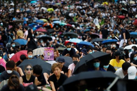 People take part in a general strike at Tamar Park in Hong Kong