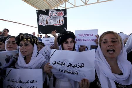 Displaced female demonstrators from the minority Yazidi sect gather during a protest outside the headquarters of the UN Mission in Iraq (UNAMI) in northern Arbil province, north of Baghdad, August 2, 2015. REUTERS/Azad Lashkari