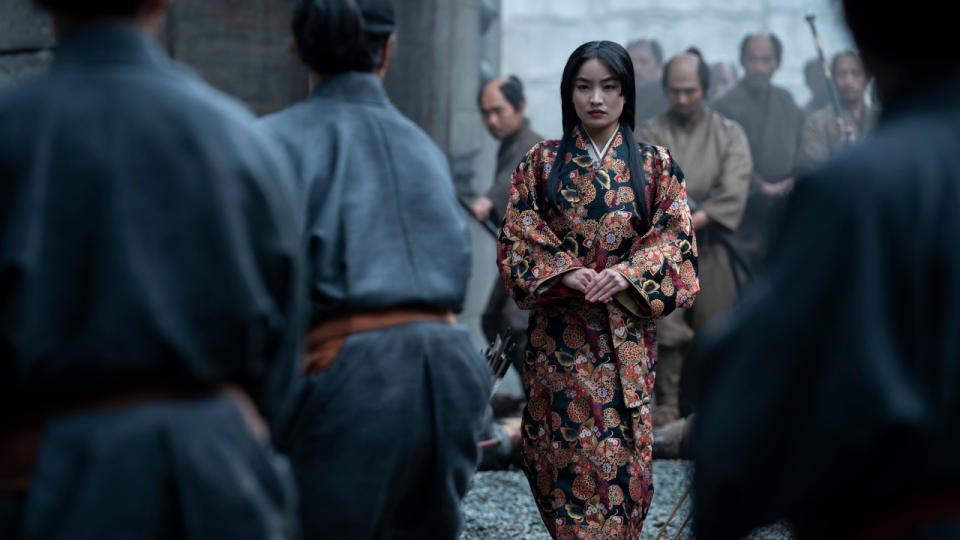 Anna Sawai walking into a crowded scene in Shōgun.