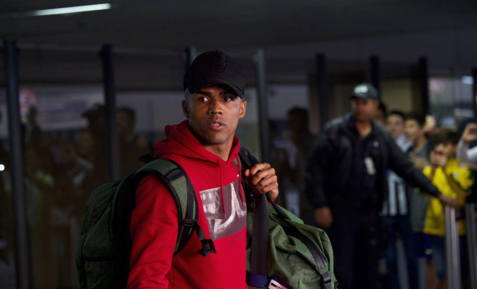 Douglas Costa faces the fans after Brazil's World Cup exit